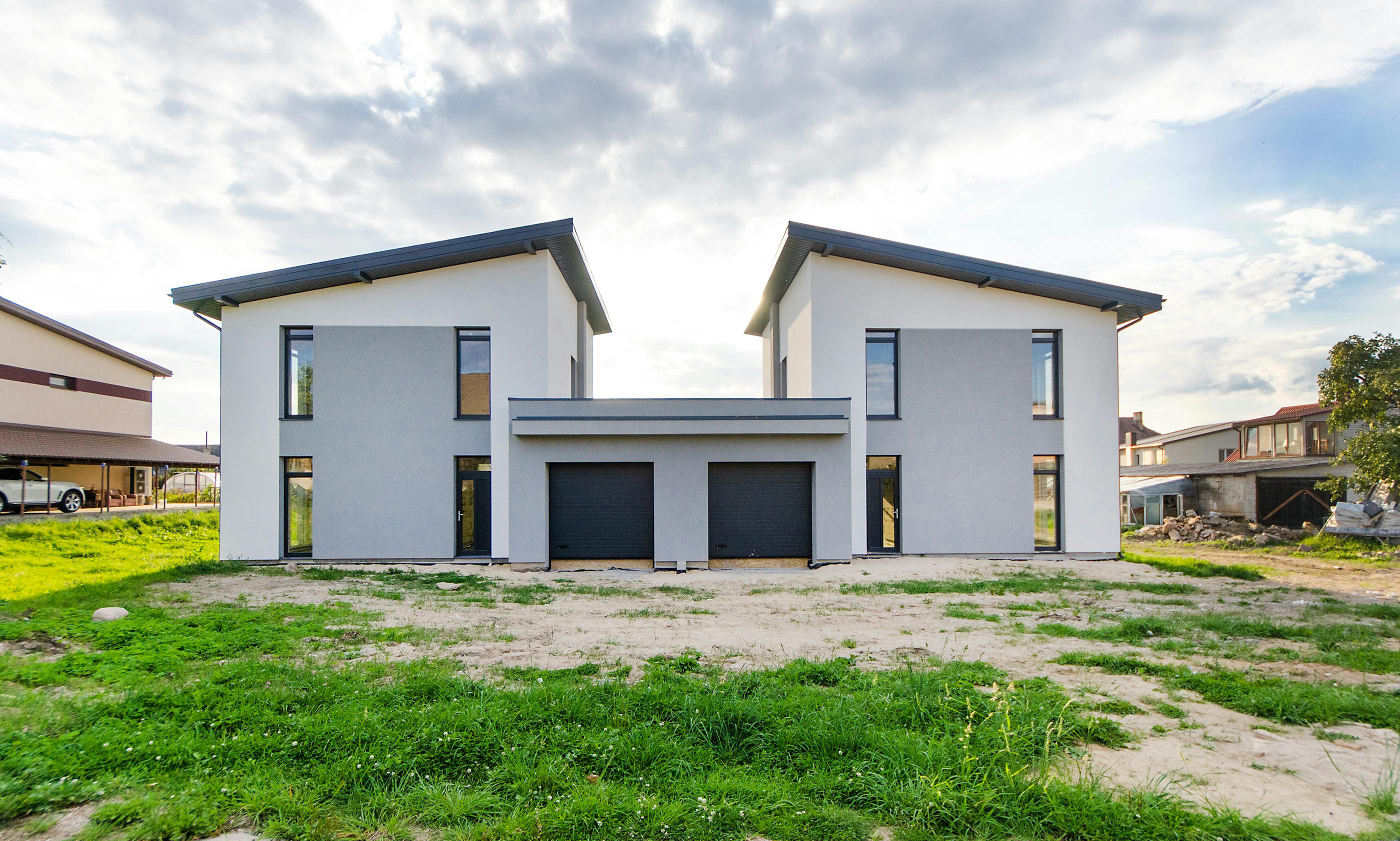 Modern twin houses with symmetrical design