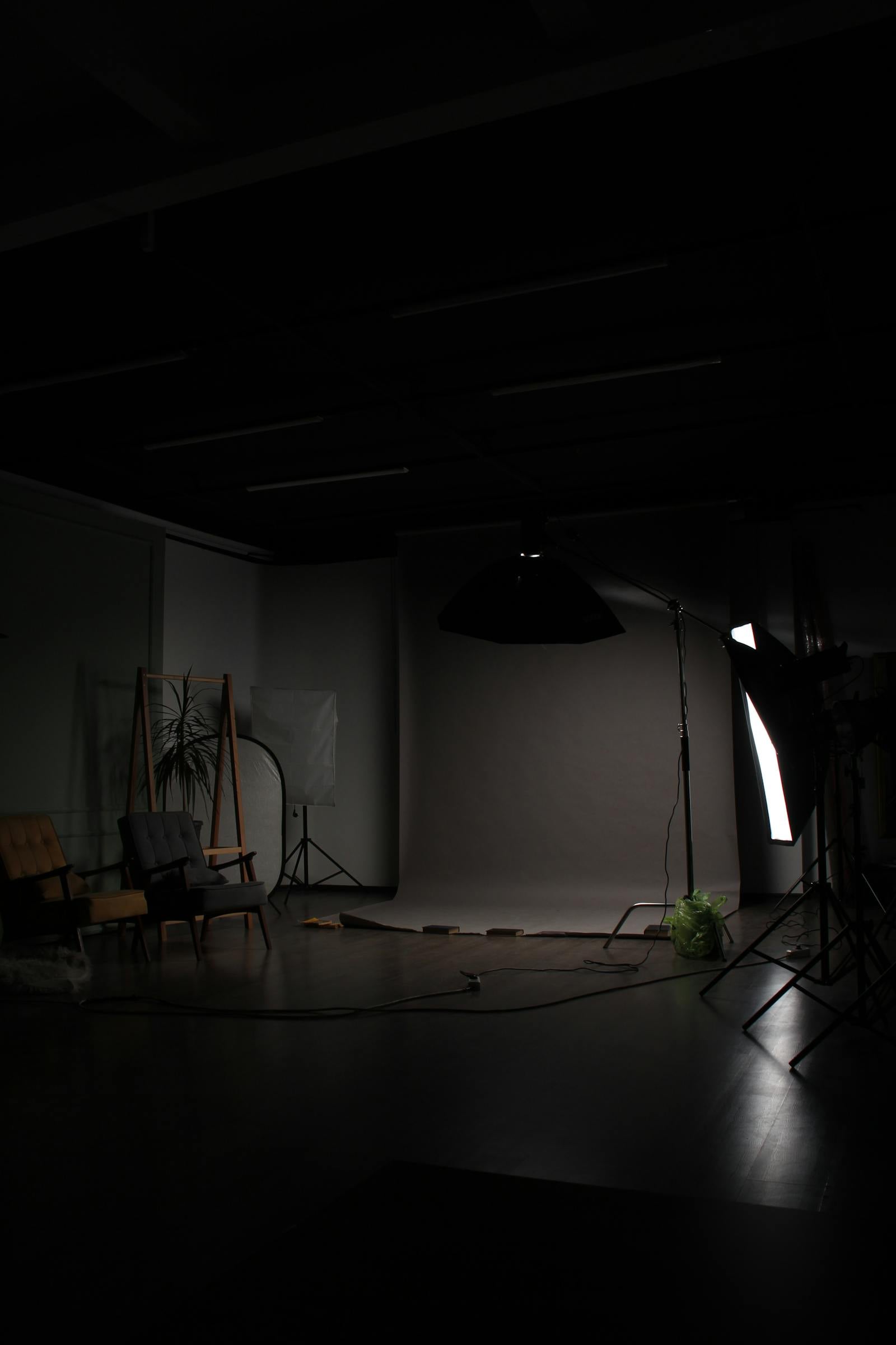 Quiet, dark photo studio interior with chairs
